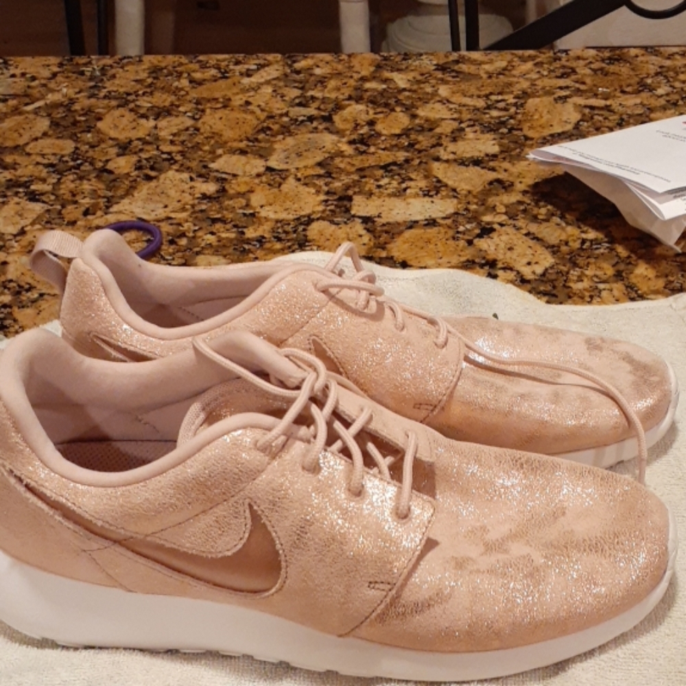 Womens Nike pink with gold shimmer